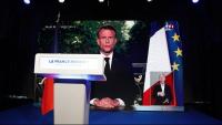 El discurs televisat de Macron, projectat aquest diumenge en una pantalla a la seu electoral de l'RN