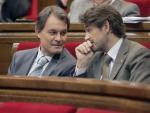 El futur president de la Generalitat, Artur Mas, i Oriol Pujol, president del grup de CiU, en un ple del Parlament, el juliol passat JOSEP LOSADA