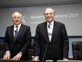 Joan Maria Nin i Isidre Fainé, director general i president de La Caixa, en l'assemblea que ha aprovat traspassar el negoci financer a Caixa Bank. L'ECONÒMIC