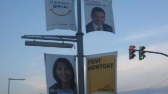 Cartells electorals de CiU i d'ERC, dos dels partits que podrien entendre's per formar govern a Montgat J.G.N