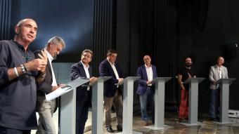 Els set candidats ahir en el debat a l'auditori Irla de la Generalitat. Llach, Bruguera, Millo, Dilmé, Vidal, Salellas i Castel, a l'inici de les intervencions QUIM PUIG